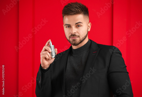 Handsome young man with bot...