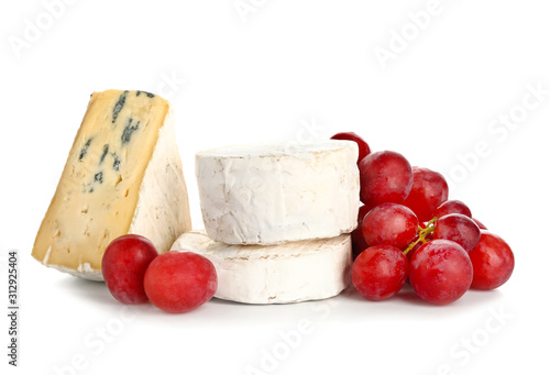 Tasty cheese with grapes on white background