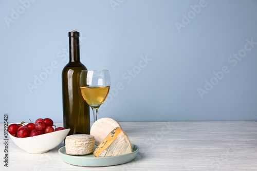 Fresh cheese with wine on white table