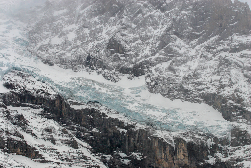 Fototapeta premium Mönch Mountain, Jungfrau Mountain in fog , Bernese Oberland, Canton of Bern, Switzerland, Europe