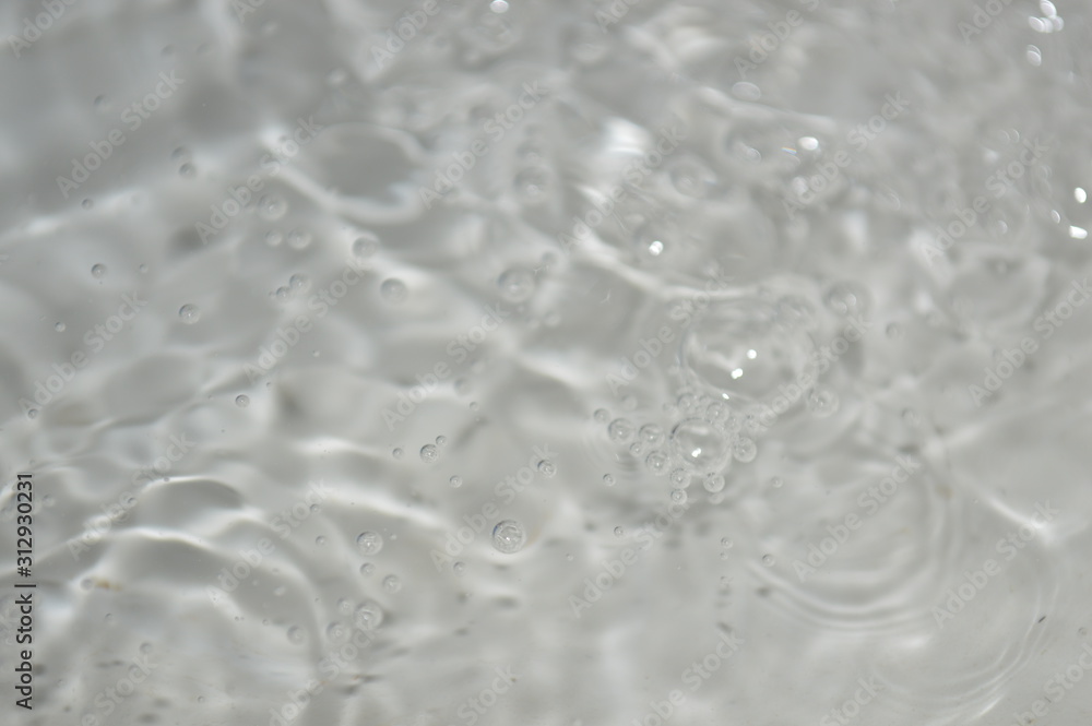 The surface of the water in a white container The surface of the water in a white container