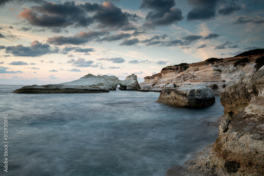 Rocky seashore seascape with wavy ocean at sea caves coastal area  in Paphos, Cyprus