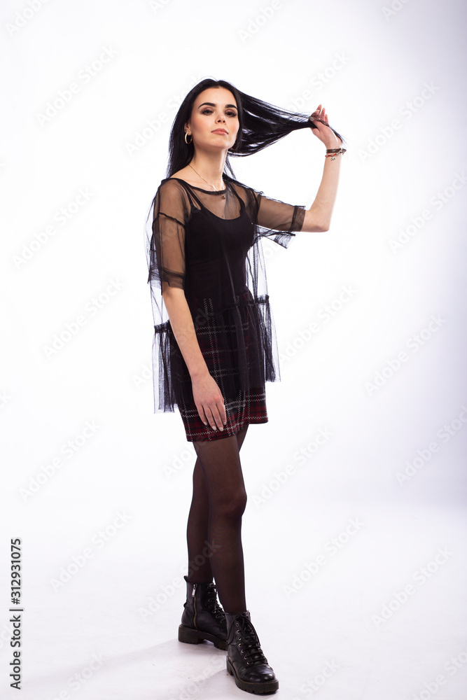 Fototapeta premium Young beautiful brunette girl on white background
