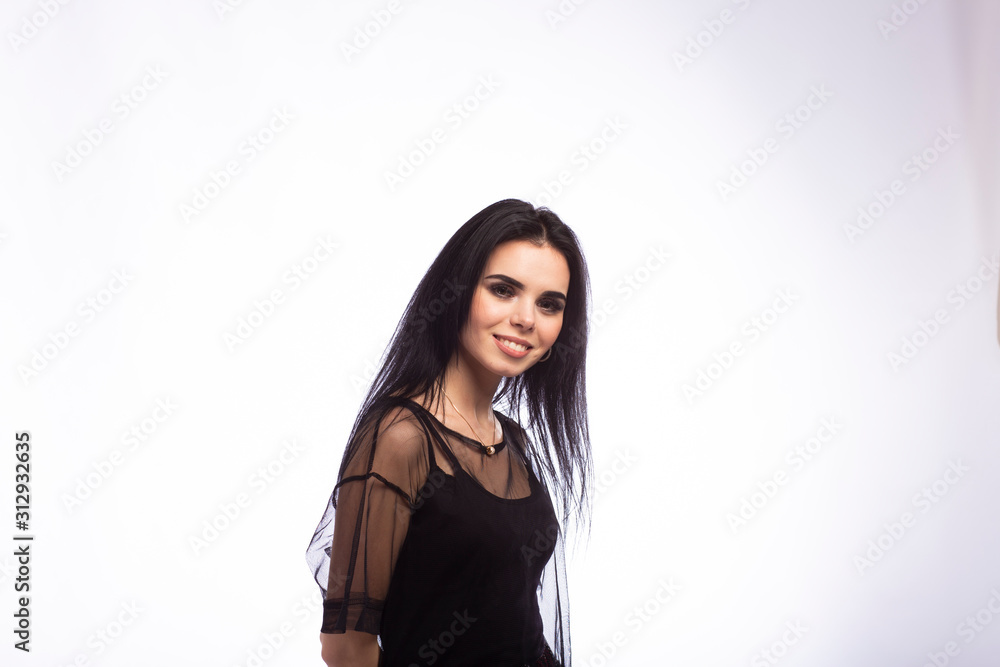 Young beautiful brunette girl on white background Young beautiful brunette girl on white background