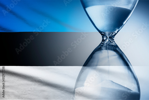 Flag of Estonia with superimposed hourglass conceptual of deadlines