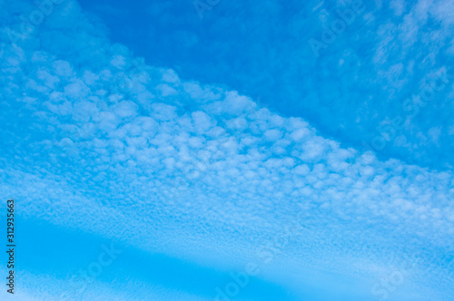 Blue sky with little cirrus clouds, Partly cloudy sky © Aliaksandr Kisel
