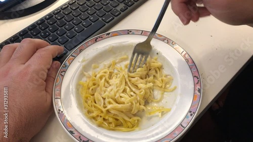 Eating pasta working computer