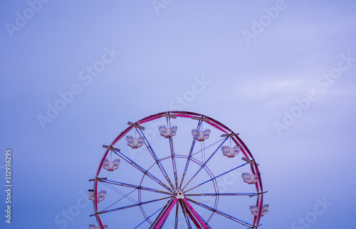 Ferris wheel against clear skyline