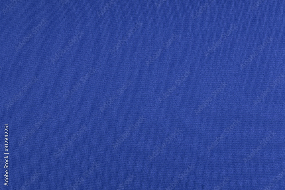 Sport Clothing Fabric Texture Background. Top View of Cloth Textile Surface. Blue Football Shirt With Copyspace. Sport Clothing Fabric Texture Background. Top View of Cloth Textile Surface. Blue Football Shirt With Copyspace.