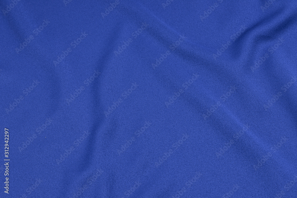 Sport Clothing Fabric Texture Background. Top View of Cloth Textile Surface. Blue Football Shirt With Copyspace. Sport Clothing Fabric Texture Background. Top View of Cloth Textile Surface. Blue Football Shirt With Copyspace.