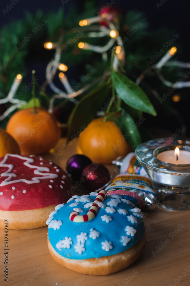Christmas cakes on the table with tangerines