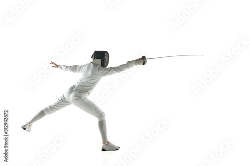 Photos Teen girls in fencing costumes with swords in hands isolated on white studio background