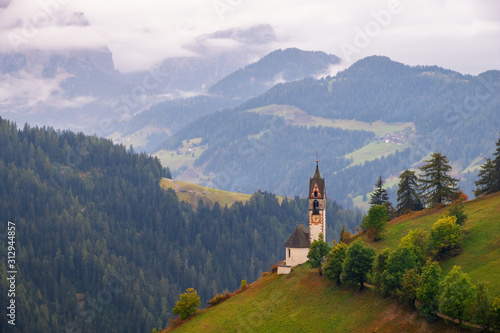 Church of Santa Barbara in the cozy little village of La Valle, Alta Badia, South Tyrol at sunset