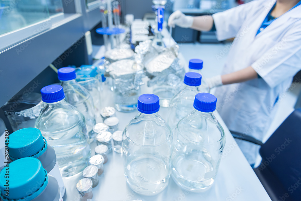 Fototapeta premium The scientists injected chemicals into plastic tubes,Scientist mix chemicals with The shake machine Before the experiment.Mixture laced with samples into test tubes,prepare sample for test