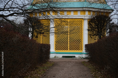 facade of an old building. yellow building façade. sculptures and decorative elements on the facade of buildings. palace in moscow Russia.