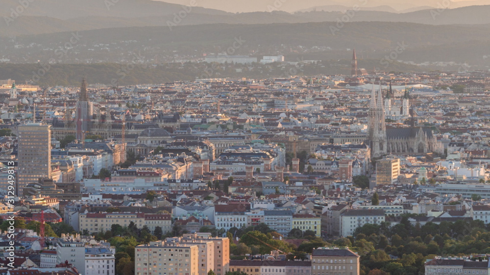 Aerial panoramic view of Vienna city with skyscrapers, historic buildings and a riverside promenade timelapse in Austria. Aerial panoramic view of Vienna city with skyscrapers, historic buildings and a riverside promenade timelapse in Austria.