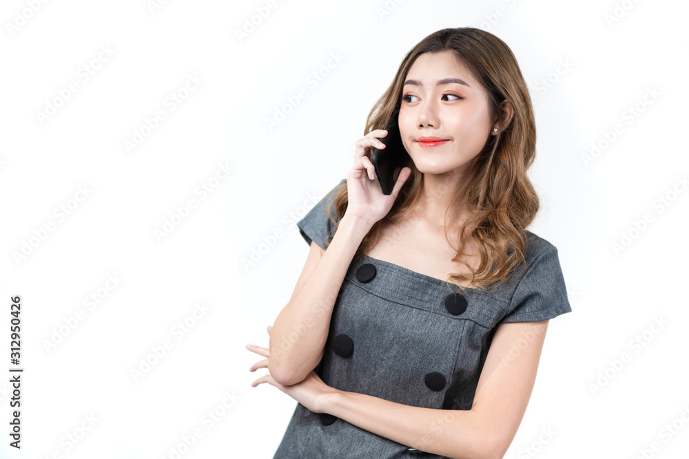 Young smart Asian woman smiling with happiness talking on smartphone and look sideways to copy space isolated in white background, concept woman with technology, communication technology lifestyle. Young smart Asian woman smiling with happiness talking on smartphone and look sideways to copy space isolated in white background, concept woman with technology, communication technology lifestyle.