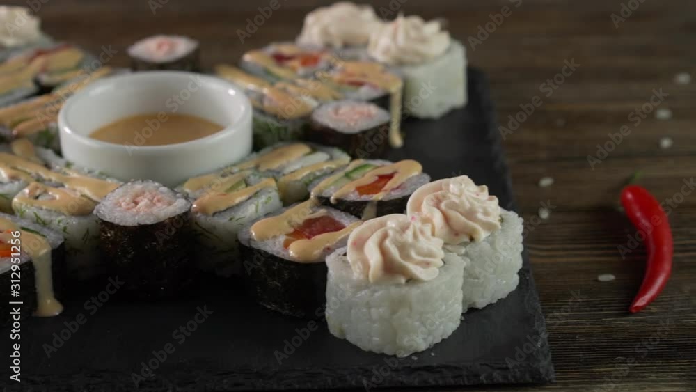 serving sushi rolls on the table. serving sushi rolls on the table.
