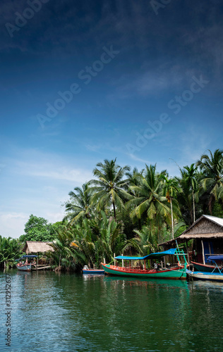 traditional jungle boat at pier on tatai river in cambodia