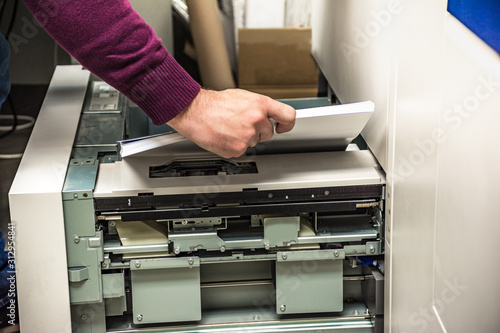 Replenishing paper in a digital printer