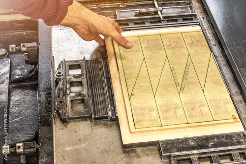 Die cutting machine to give different forms to the paper in a printing press photo