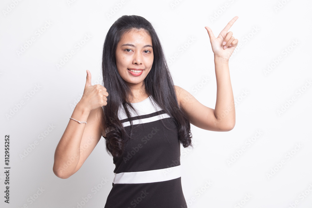 Young Asian woman point and thumbs up. Young Asian woman point and thumbs up.