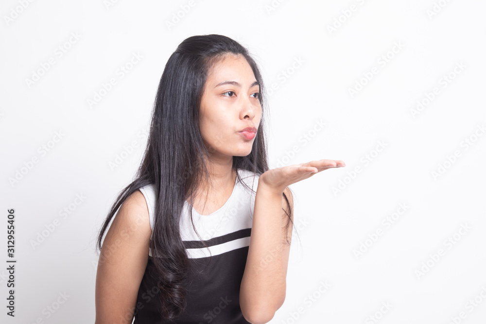 Beautiful young Asian woman blow a kiss. Beautiful young Asian woman blow a kiss.