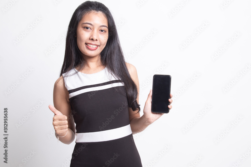 Young Asian woman show thumb up with mobile phone. Young Asian woman show thumb up with mobile phone.