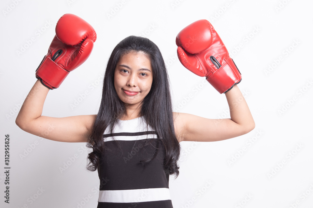 Young Asian woman with red boxing gloves. Young Asian woman with red boxing gloves.