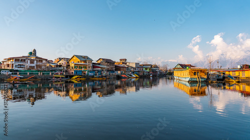 View of  Dal lake  and boat house before sunset in the heart of Srinagar during winter  , Srinagar , Kashmir , India photo
