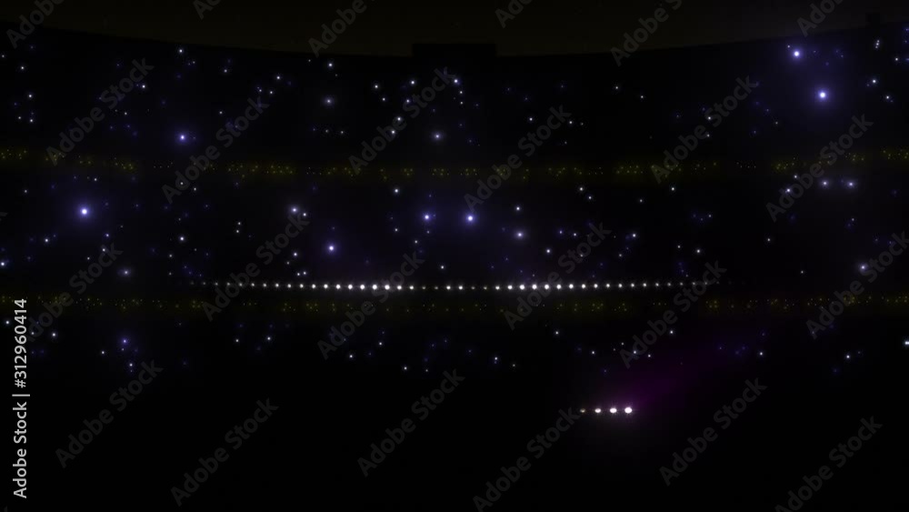 Stadium floodlights shining brightly and turning on and off. Purple