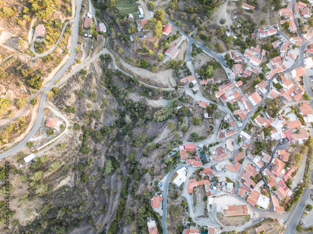 Aerial view of old mountain Cyprus village with orange roofs of buildings, Cyprus