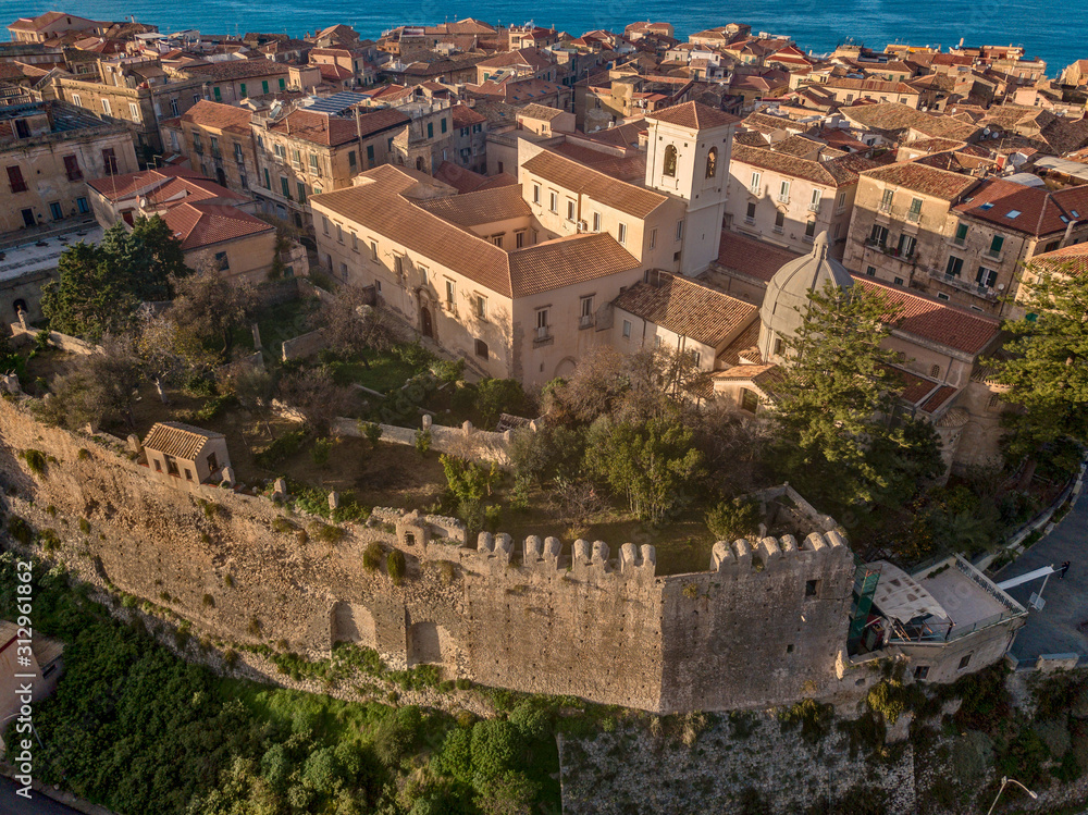 Aerial view of the cathedral, Cathedral of Maria Santissima of Romania. Roofs and houses of the city of Tropea, Calabria. Italy. 