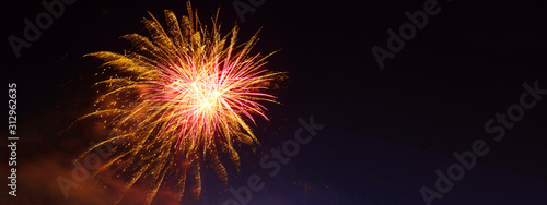 Ultra wide panoramic night shot of beautiful slow shutter fireworks as seen during festive celebration