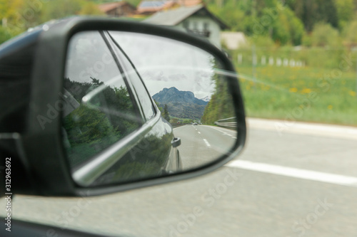 reflection of the rear view in the mirror side view of the car © Dziana
