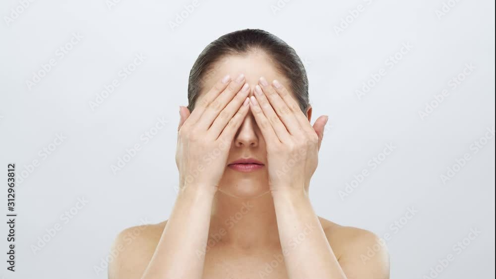 Studio portrait of young, beautiful and natural blond woman applying skin care cream. Face lifting, cosmetics and make-up. Studio portrait of young, beautiful and natural blond woman applying skin care cream. Face lifting, cosmetics and make-up.