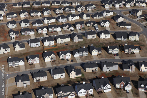 Aerial view of neat rows of new suburban homes and streets near Atlanta Georgia.  
