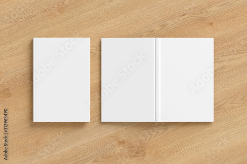 Blank white vertical closed and open and upside down book cover on wooden background isolated with clipping path around cover. 3d illustration