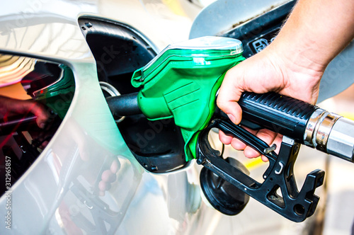 Refueling the car on the pump station. 