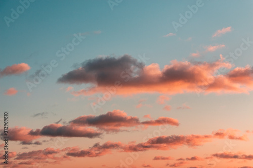 orange clouds in the light of raspberry sunset