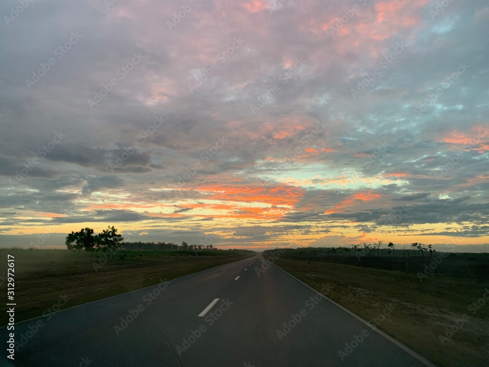 Endless road in Cuba, sunset