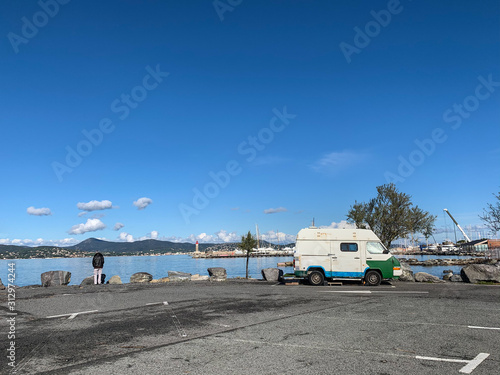 Small vintage van on the parking by the sea