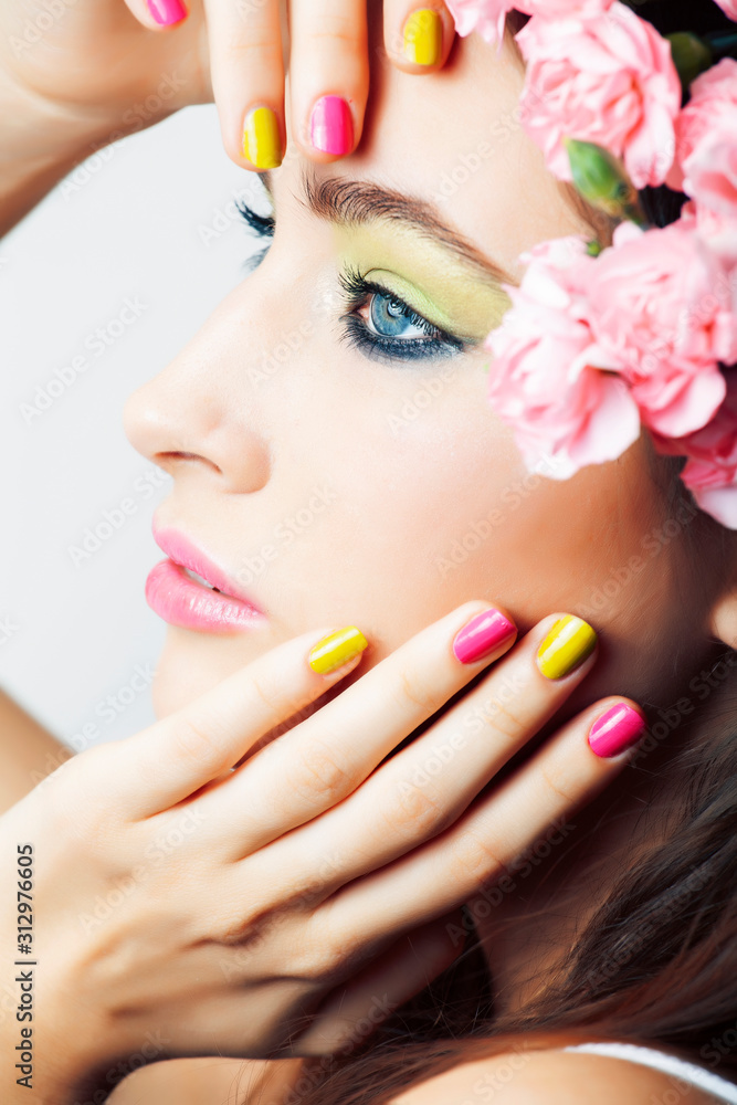 young pretty brunette woman with pink flowers and manicure posing cheerful isolated on white background closeup young pretty brunette woman with pink flowers and manicure posing cheerful isolated on white background closeup