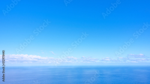 Panorama of the sea with clouds above the horizon