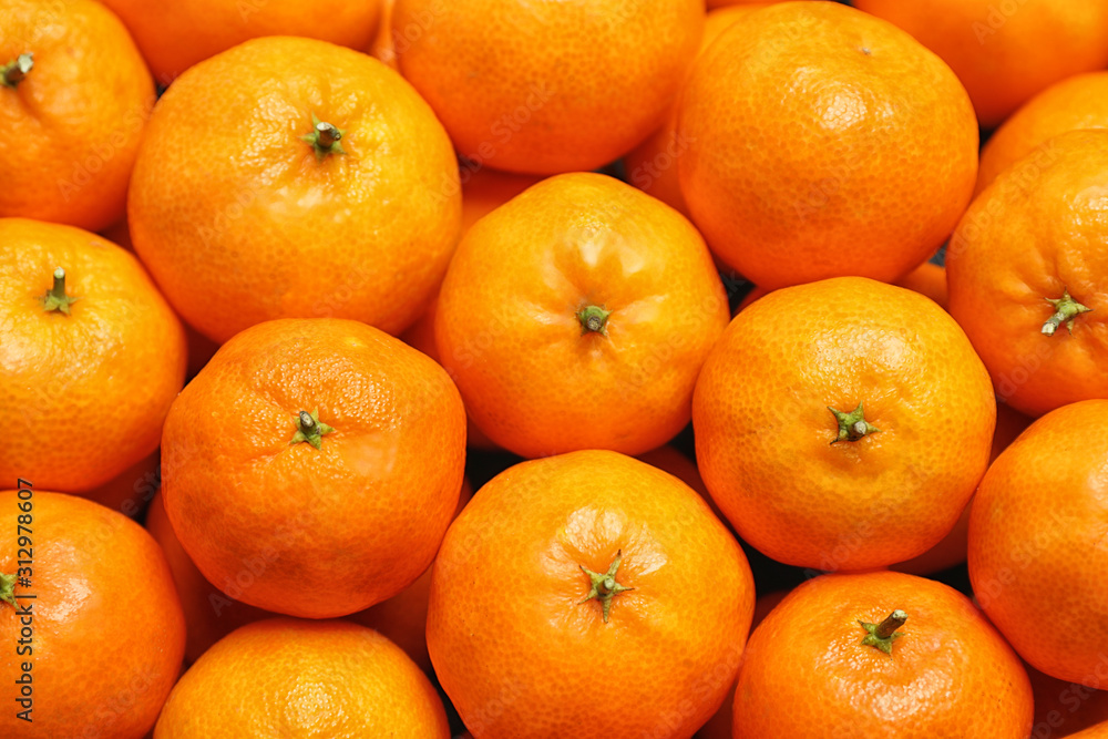 Delicious fresh ripe tangerines as background, top view Delicious fresh ripe tangerines as background, top view