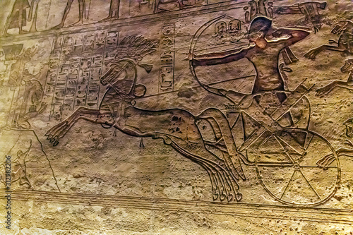 Fotografie Ramses II on his chariot shooting arrows, bas-relief, battle Kadesh, Abu Simbel