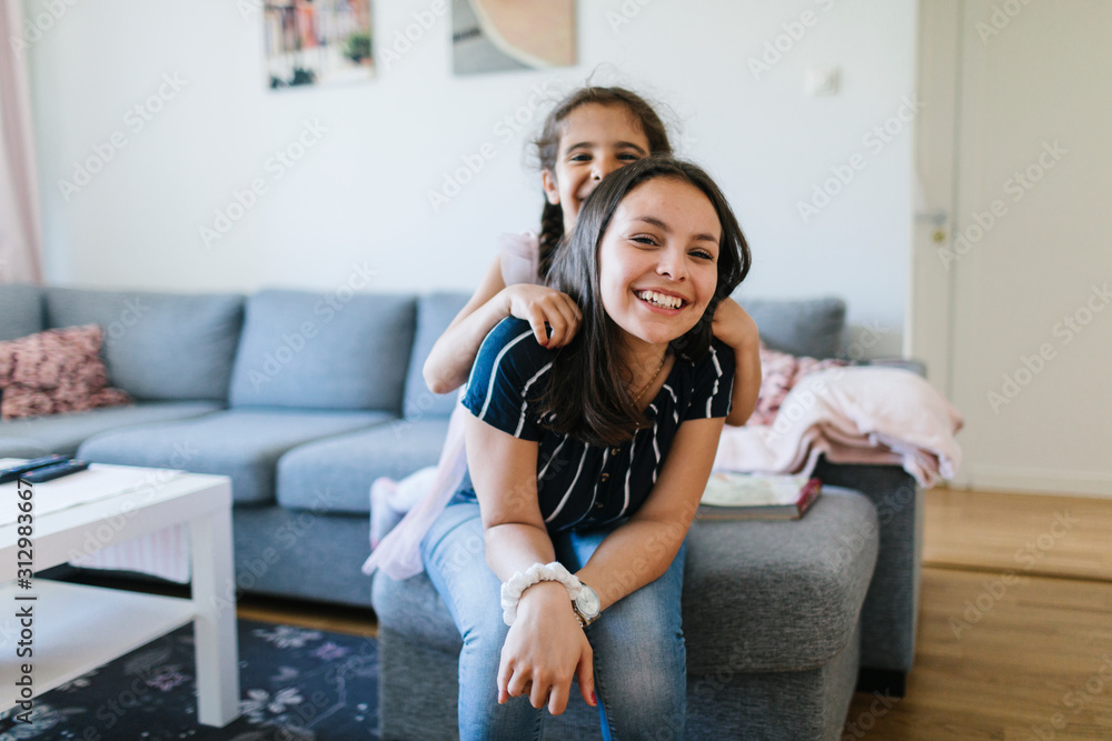 Smiling sisters together Smiling sisters together