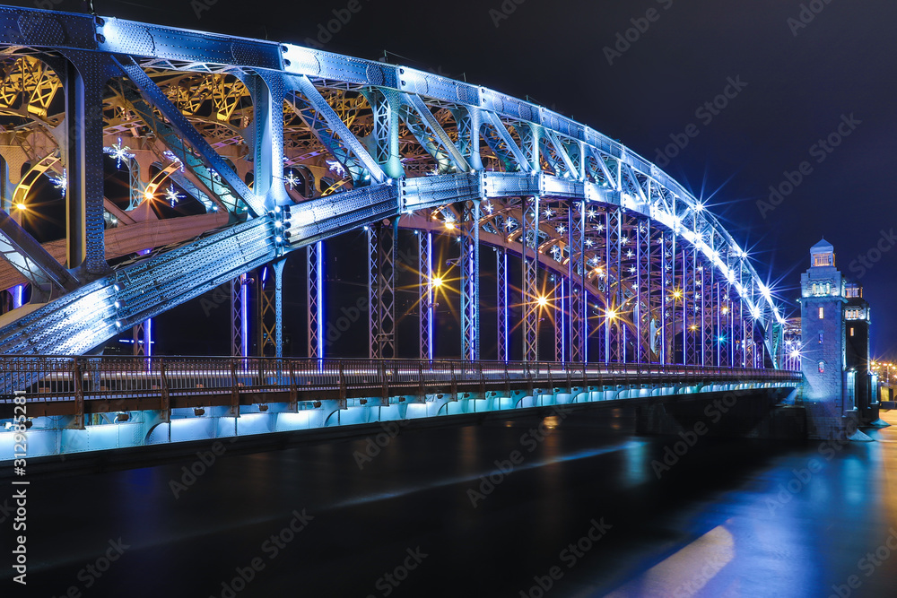 Obraz premium View on the Bolsheokhtinsky or Peter the Great Bridge across the Neva River in Saint Petersburg, Russia in the winter New Year or Christmas night