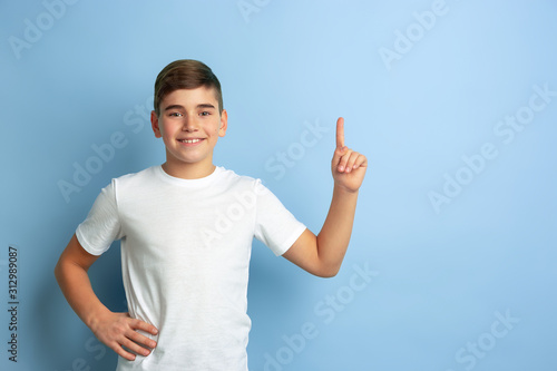 Bild auf Leinwand Smiling and pointing up