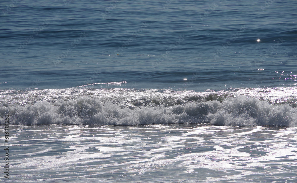 Full frame sectional view of ocean water with a wave at the beach
